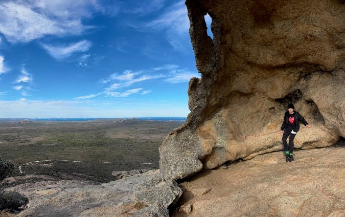 A hiker in the summit cave of Frenchman Peak