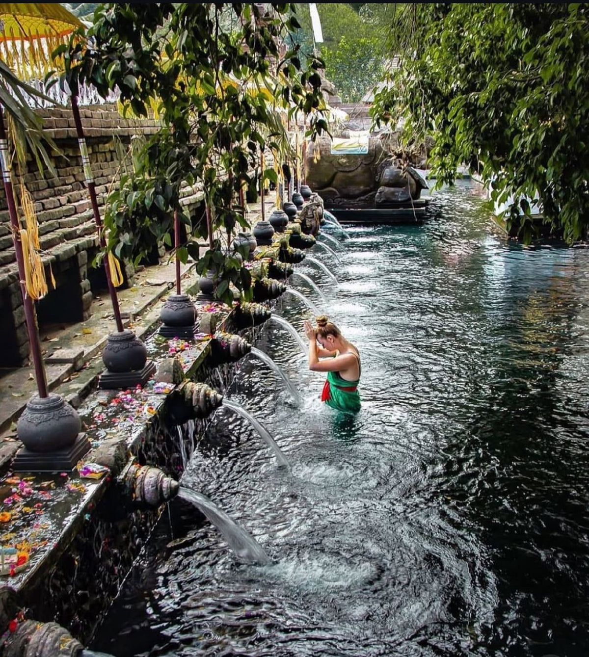 A purification ritual in the spring water of a Balinese temple