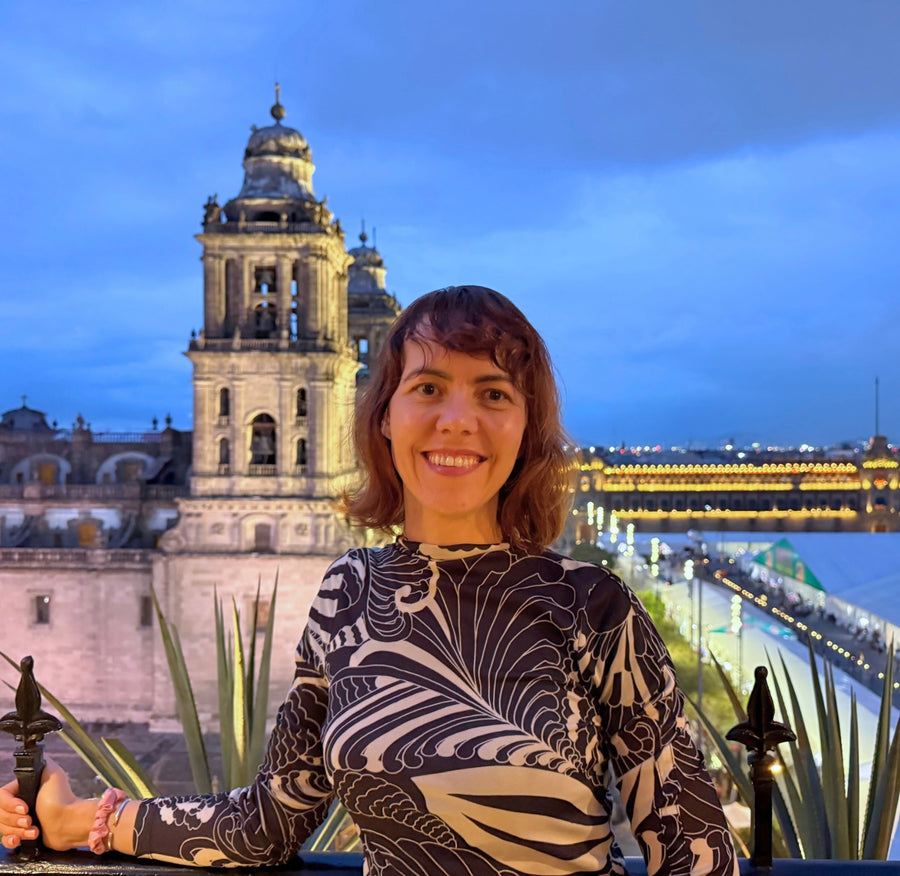Olga Plotnikova in Mexico City, with the Metropolitan Cathedral behind her